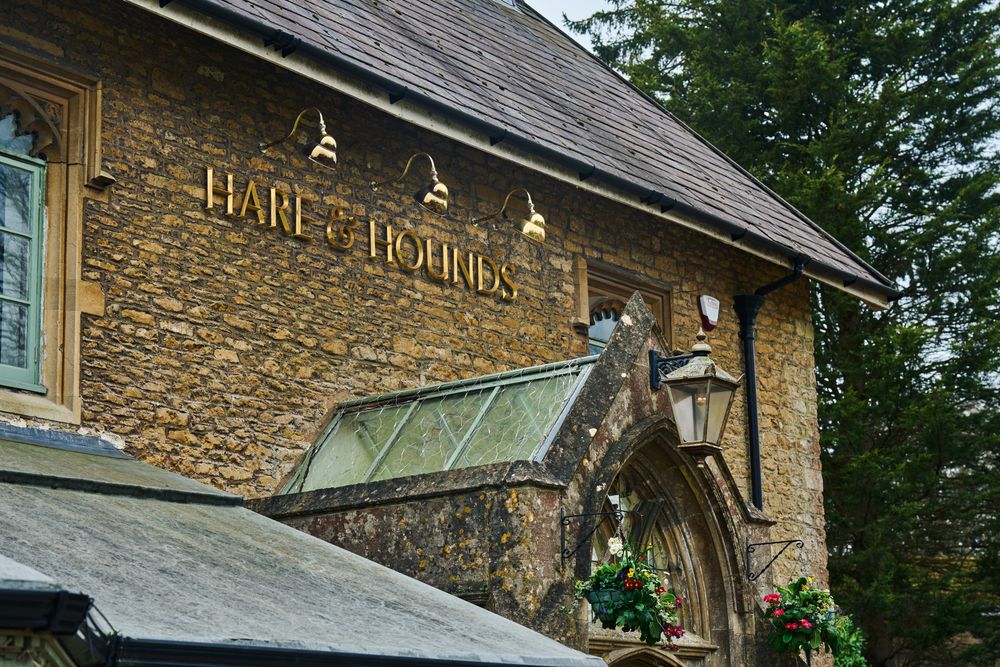 The stone exterior of the Hare and Hounds in Bath